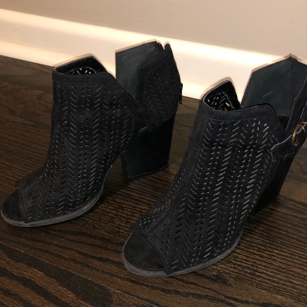 Loosely worn black peep-toe booties